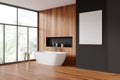 Gray and wooden bathroom with tub and poster Royalty Free Stock Photo