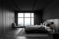 Gray and wooden bedroom with armchair and window Royalty Free Stock Photo