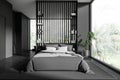 Gray and wooden bedroom and bathroom interior Royalty Free Stock Photo