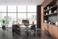 Gray and wooden CEO office interior with bookcase Royalty Free Stock Photo