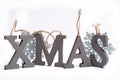 Gray wooden decorative letters X M A S with snowflakes copy space isolated white background, Christmas holidays postcard concept Royalty Free Stock Photo