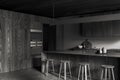 Gray and wooden kitchen corner with bar Royalty Free Stock Photo