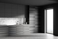 Gray and wooden kitchen corner with cupboards