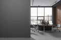 Gray and wooden open space office interior with blank wall Royalty Free Stock Photo