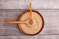 Collecting dry cereals. On a wooden background, buckwheat, rice, oatmeal in a large brown plate. Royalty Free Stock Photo