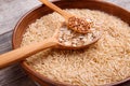 Collecting dry cereals. On a wooden background, buckwheat, rice, oatmeal in a large brown plate. Royalty Free Stock Photo