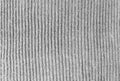 Gray woolen knitwear fabric texture. Closeup of sweater, knitted pattern background. Winter design. Flat lay, top view.