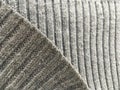 Gray woolen winter sweater. Abstract textured wallpaper.