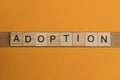 Gray word adoption made of wooden square letters Royalty Free Stock Photo