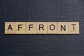 Gray word affront from small wooden letters Royalty Free Stock Photo