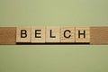 Gray word belch from small wooden letters