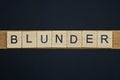 Gray word blunder from small wooden letters Royalty Free Stock Photo