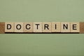 Gray word doctrine from small wooden letters
