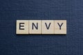 gray word envy from small wooden letters