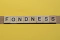 The gray word fondness of gray small wooden letters