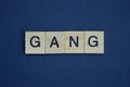 Gray word gang from small wooden letters
