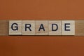 Gray word grade made of wooden square letters