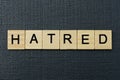 Gray word hatred from small wooden letters Royalty Free Stock Photo