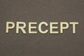 gray word precept made of wooden letters