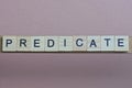 gray word predicate made of wooden square letters
