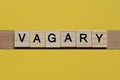 The gray word vagary of gray small wooden letters