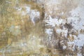 Gray-yellow old wall with layers of paint. Concrete texture. Oil paint on canvas Royalty Free Stock Photo