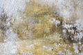 Gray-yellow old wall with layers of paint. Concrete texture. Oil paint on canvas Royalty Free Stock Photo