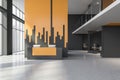Gray and yellow reception desk in business center