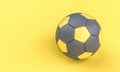 Gray and yellow soccer ball on yellow background in flat lay style