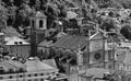 Grayscale aerial view of a cathedral and nearby buildings in Bellinzona, Switzerland