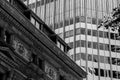 Grayscale beautiful view of an old and modern building with small windows