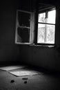 Grayscale of the broken glass window of an old house Royalty Free Stock Photo