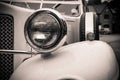 Grayscale closeup of a classical vintage headlights of a wedding car
