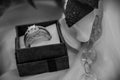 Grayscale closeup of diamond wedding ring in open small box Royalty Free Stock Photo