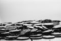 Grayscale closeup of a pile of poker chips on the table Royalty Free Stock Photo