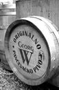 Grayscale closeup of small beer barrel in honor of George Weifert