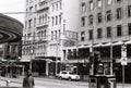 Grayscale of Elizabeth street in Melbourne with various buildings