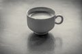 Grayscale high angle shot of a coffee mug