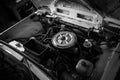 Grayscale high angle shot of an old car engine interior