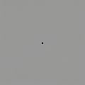 A grayscale image with a centrally placed small dot on a light gray background. The d Royalty Free Stock Photo
