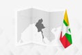 A grayscale map of Myanmar with a hanging Myanmar flag on one side. Vector map for many types of news Royalty Free Stock Photo