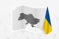 A grayscale map of Ukraine with a hanging Ukrainian flag on one side. Vector map for many types of news