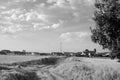Grayscale panoramic view of a pathway to a Castilian village in Spain