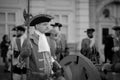 Grayscale of a person dressed in an old uniform during a historical parade in Timisoara, Romania.