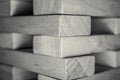 Grayscale shoof Jenga on the table under the lights with a blurry background Royalty Free Stock Photo
