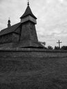 Grayscale shot of an aged wooden church in Old Village, Poland Royalty Free Stock Photo