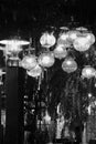 Grayscale shot of assorted ornamental hanging lights
