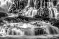 Grayscale shot of a big waterfall during daylight Royalty Free Stock Photo