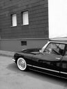 Grayscale Shot Of Black French Luxury Limousine From The Sixties With Whitewall Tires