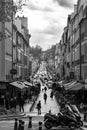 Grayscale shot of a cityscape with people on the street in Satori, Versailles, France Royalty Free Stock Photo
